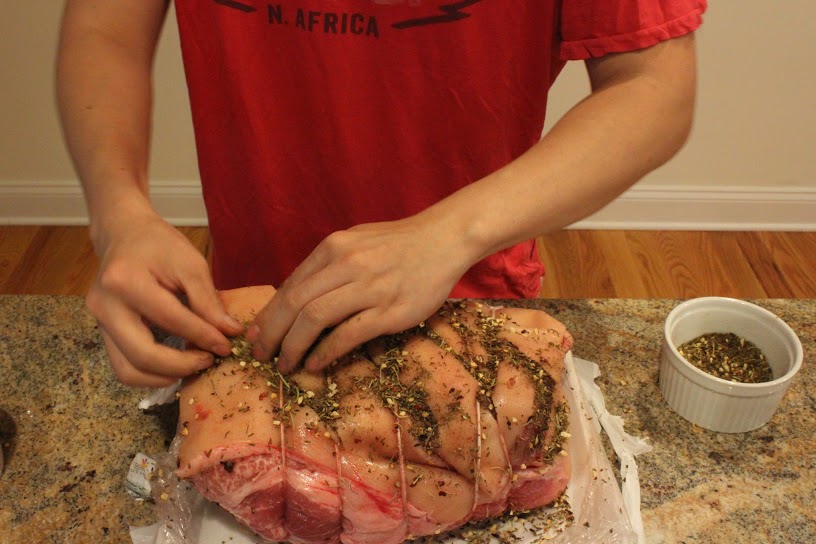 Adding spices. Make sure to get it into the crevices and into the butterfly cut (if you actually got it -- I didn